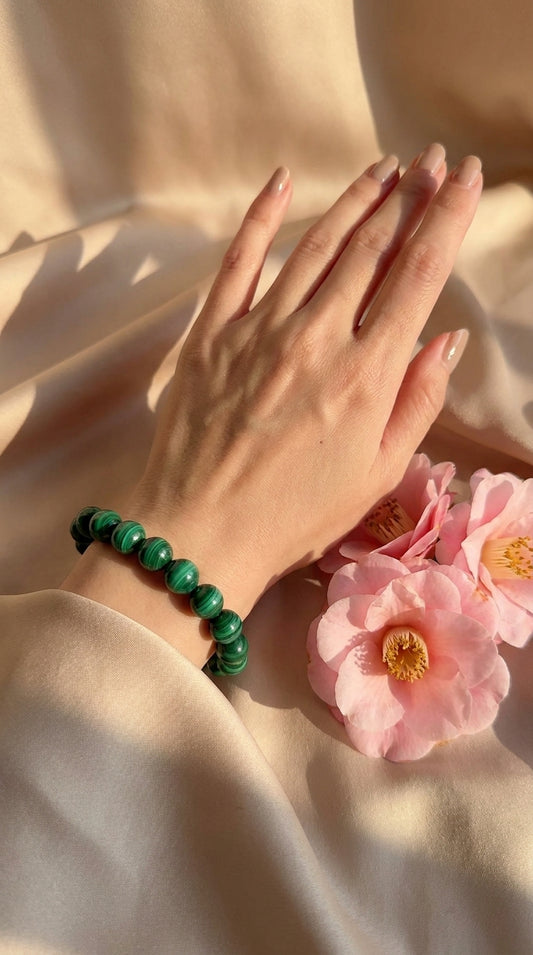 Natural malachite bracelet worn on the wrist in soft natural light